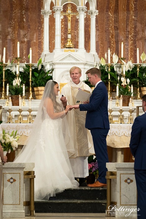 Bride And Groom Saying Vows With Wedding Officiant