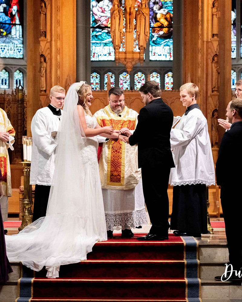 Bride and groom exchanging vows in church