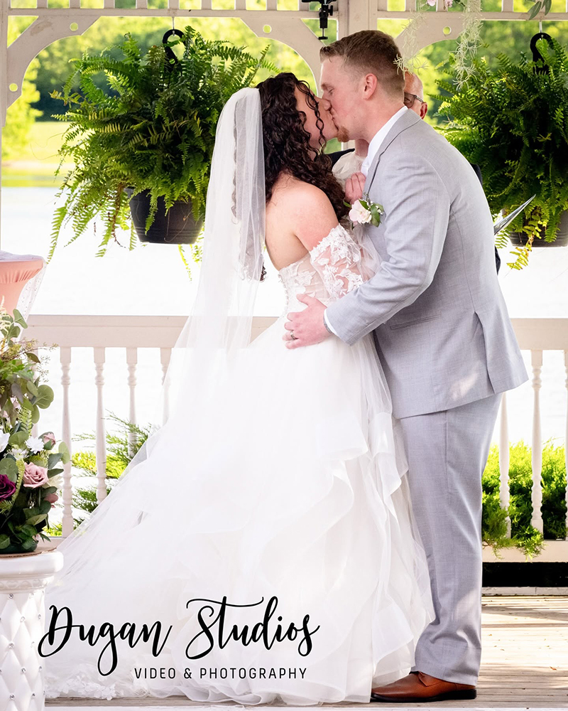 Bride and groom kissing