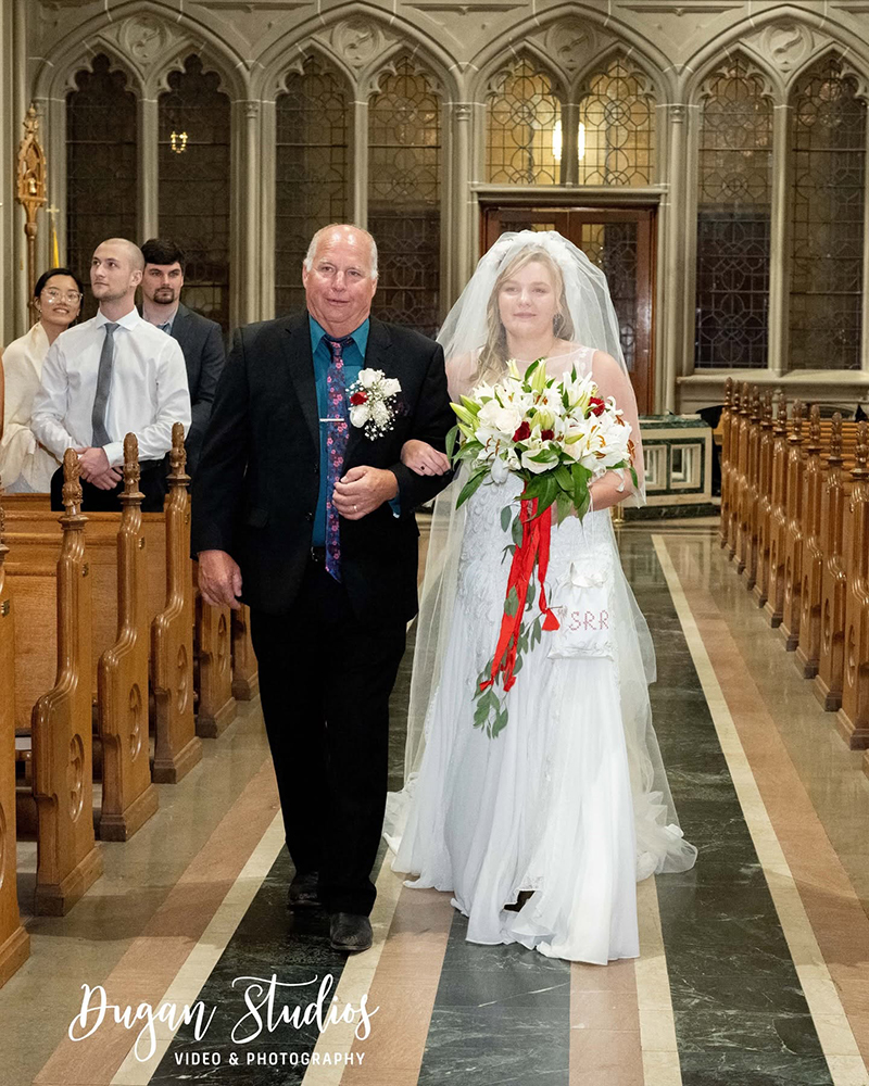 Bride walking down the aisle with father