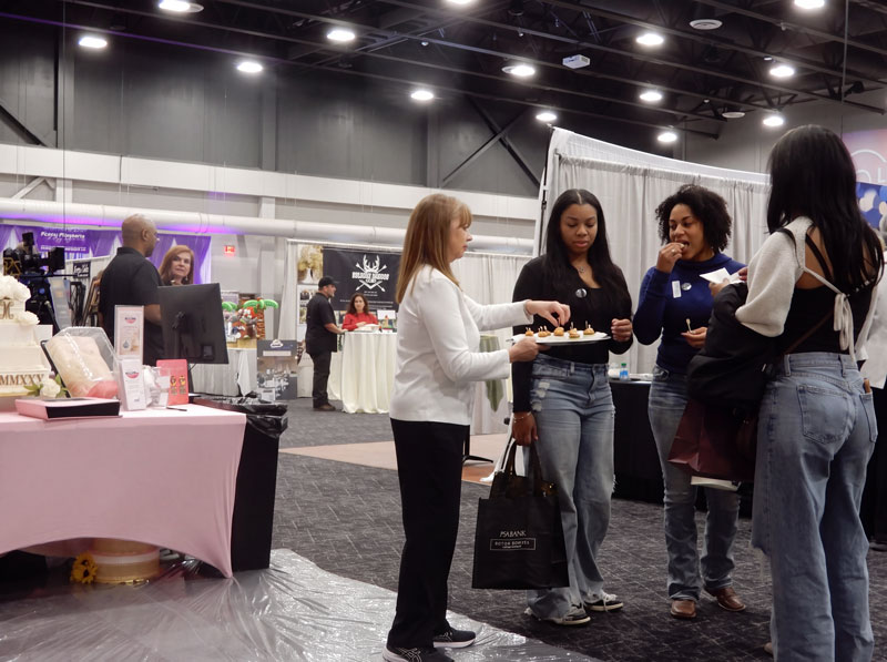 Tasting wedding cake samples at Wendy's Wedding Expo in Cincinnati Ohio