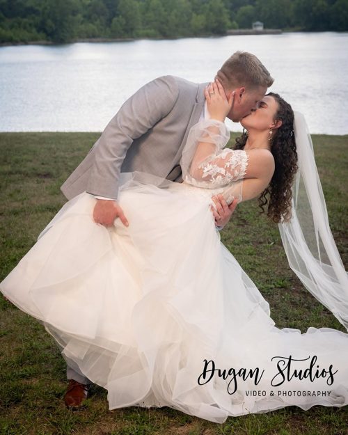 Bride and groom dip-kissing